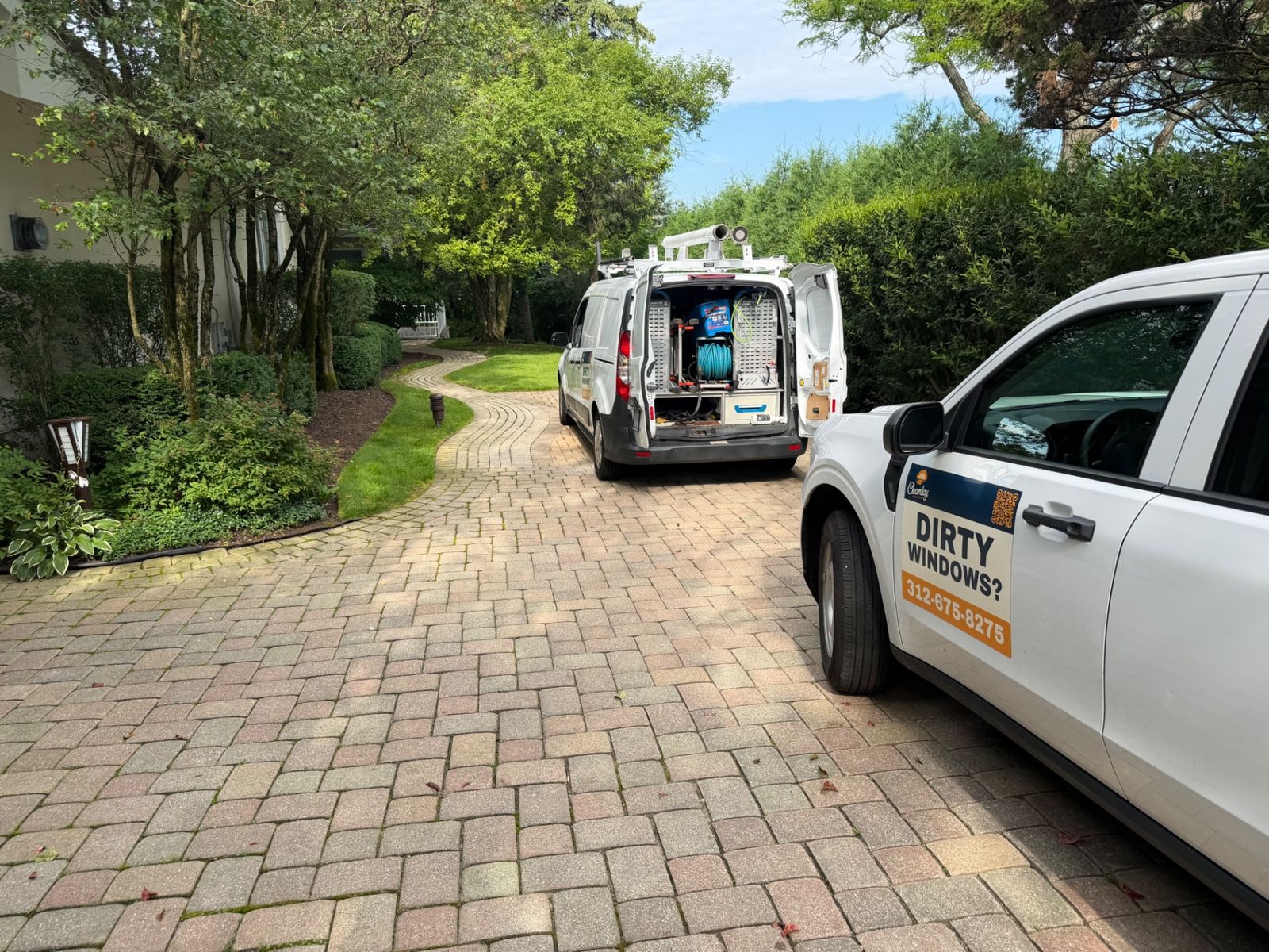 ClearDay pure-water van parked on a paver driveway