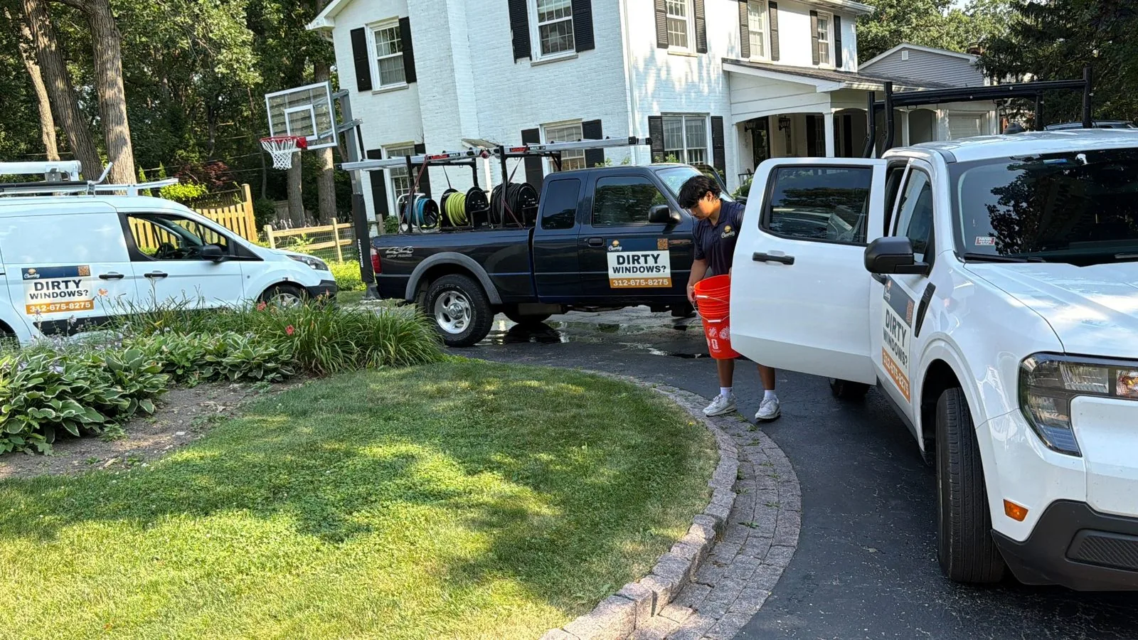 ClearDay crew and service trucks at a residential cleaning job