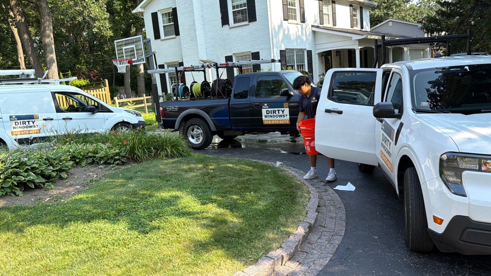 ClearDay trucks parked at a residential window cleaning job